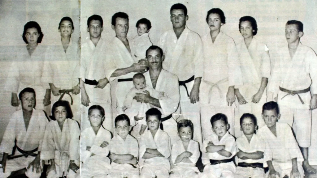 Gracie family members posing to a picture all wearing kimonos.